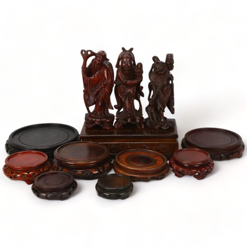 224 - A group of Chinese carved wood stands, and 3 Chinese carved wood figures