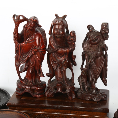 224 - A group of Chinese carved wood stands, and 3 Chinese carved wood figures