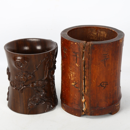 228 - A Chinese hardwood brush pot with bee and blossom carving, together with a bamboo carved brush pot A... 