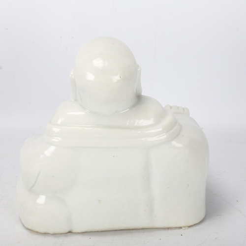 230 - A Chinese Blanc de Chine figure of a laughing Buddah, label under base 