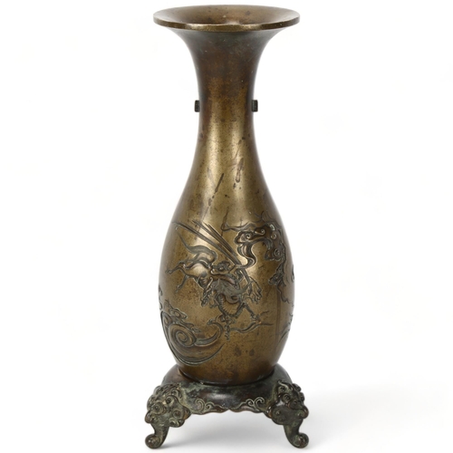 231 - A Chinese heavy bronze vase on stand, decorated with 