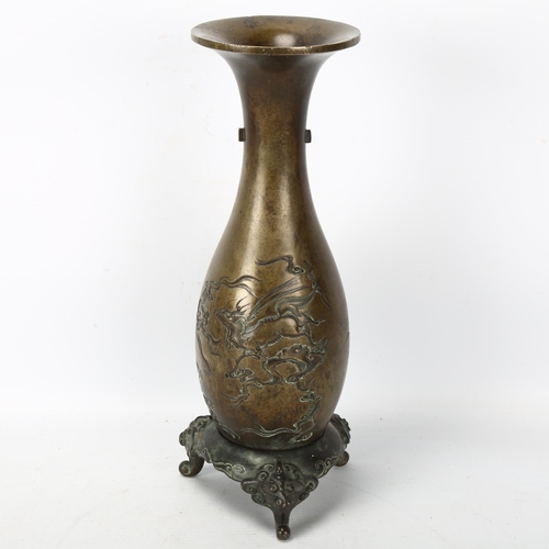 231 - A Chinese heavy bronze vase on stand, decorated with 