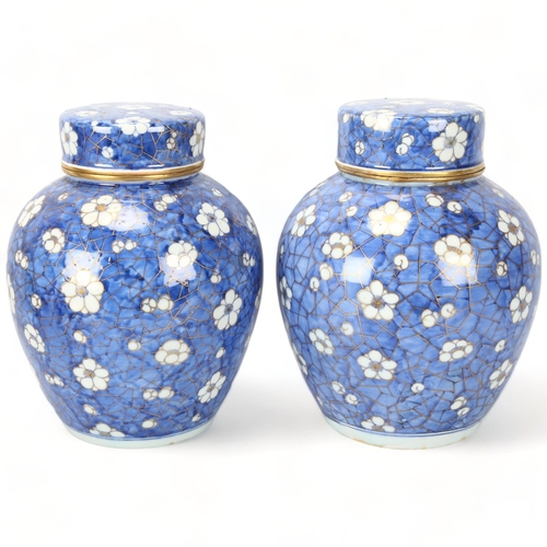 233 - Pair of Chinese blue and white porcelain jars and covers, with gilded decoration, height 25cm