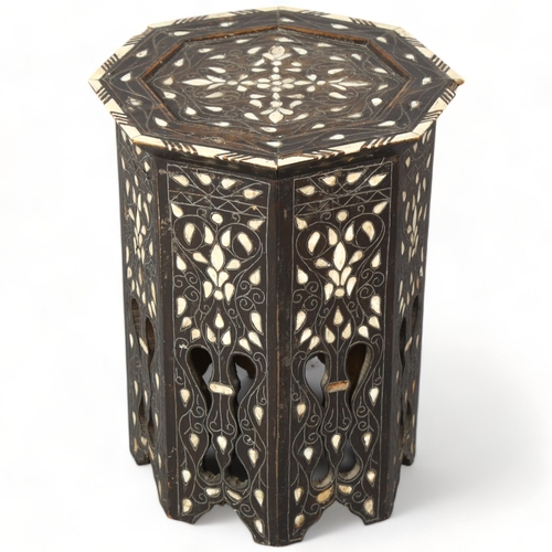 248 - A Middle Eastern octagonal occasional table, with inlaid mother-of-pearl bone and wirework decoratio... 