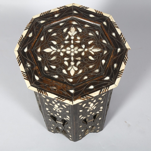 248 - A Middle Eastern octagonal occasional table, with inlaid mother-of-pearl bone and wirework decoratio... 