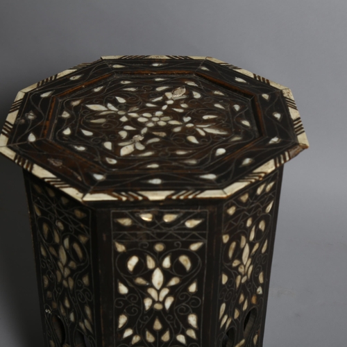 248 - A Middle Eastern octagonal occasional table, with inlaid mother-of-pearl bone and wirework decoratio... 