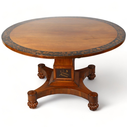 249 - A Late Victorian mahogany centre table, with veneer fringe and panels on stem decorated with fruit a... 