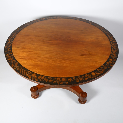 249 - A Late Victorian mahogany centre table, with veneer fringe and panels on stem decorated with fruit a... 