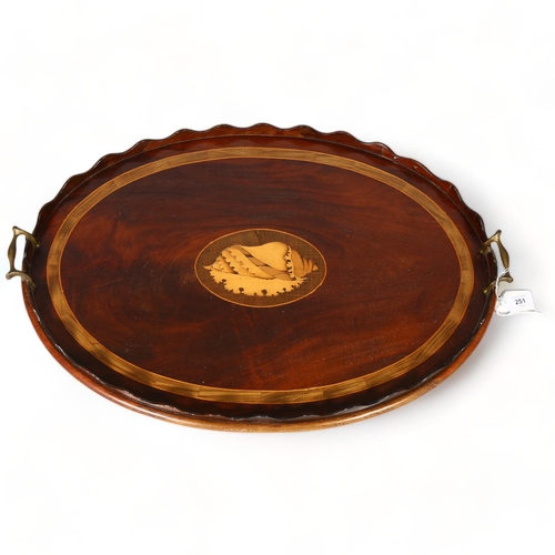 251 - A Georgian mahogany tray with inlay boxwood conch shell motif and brass handles, length 69cm