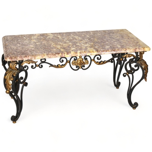 254 - A marble topped coffee table on ornate wrought iron base, height 50cm, top 94 x 45cm