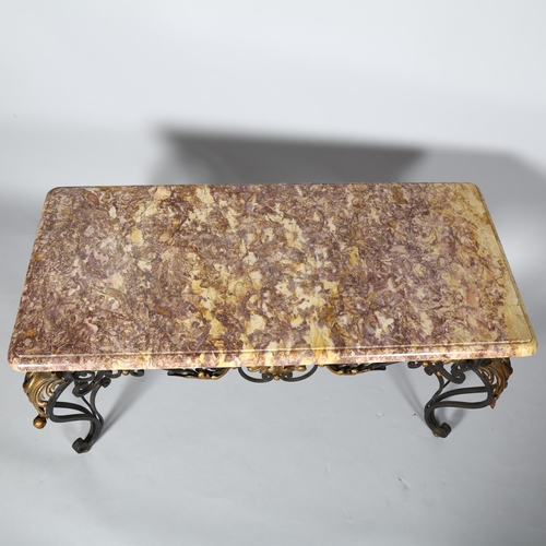 254 - A marble topped coffee table on ornate wrought iron base, height 50cm, top 94 x 45cm