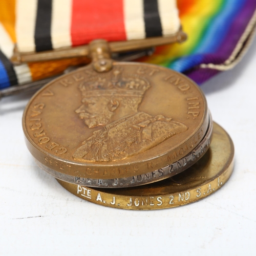 275 - First World War medals to Pte AJ Jones S.A.I, and a number of other medals, coins and badges, Croix ... 