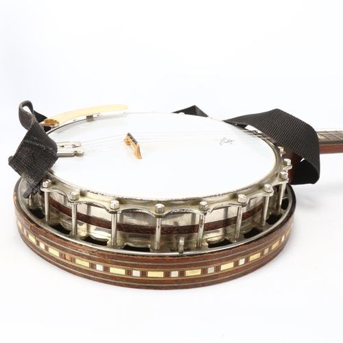 280 - **WITHDRAWN**A Clifford Essex & Son, Regal 401 four string banjo, with inlaid resonator, mother of p... 