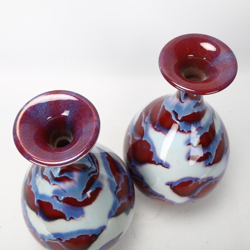 44 - Pair of Chinese mottled sang de boeuf glaze narrow-neck vases, with impressed marks, height 35cm