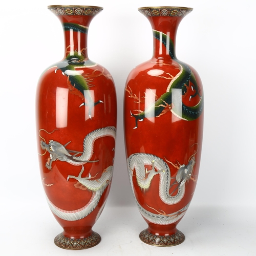 46 - A pair of large Japanese cloisonne baluster vases, with fighting dragon decoration and fine detailin... 