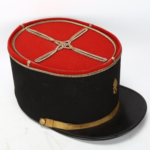 62 - A French Foreign Legion kepi, together with a copy of The Old Contemptibles