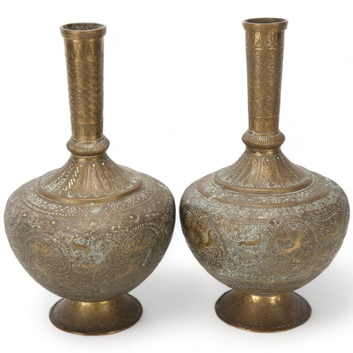 65 - Pair of 19th century bronze narrow-neck vases, Qajar, Iran, with engraved animal designs and scrolls... 