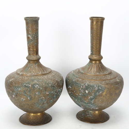 65 - Pair of 19th century bronze narrow-neck vases, Qajar, Iran, with engraved animal designs and scrolls... 