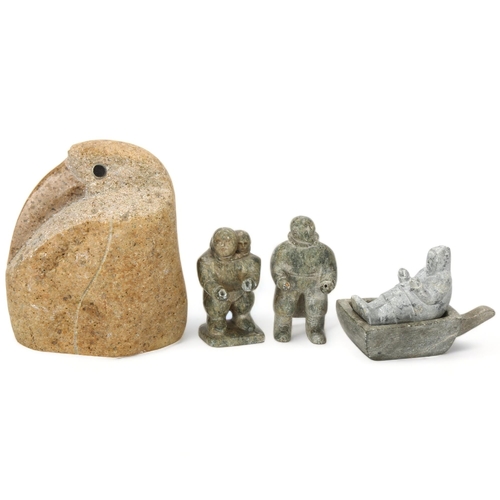 72 - An Inuit granite carving of a bird, height 15cm and three greenstone carved figures