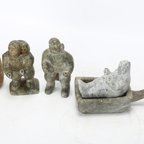 72 - An Inuit granite carving of a bird, height 15cm and three greenstone carved figures