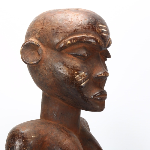 80 - An 19th century Congo wood carved female figure, height 65cm