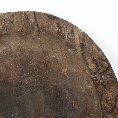 86 - A 19th century Yoruba, Nigeria, divination tray, with carved animal detail to edges, diameter 40cm