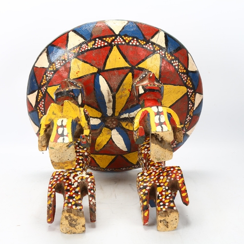 88 - A Bozo, Mali wood carved and painted stool, with male and female figure supports, height 30cm, diame... 