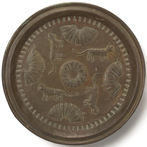 89 - A Benin, Nigeria, bronzed copper tray/charger, with leopard and manilla detail, diameter 48cm