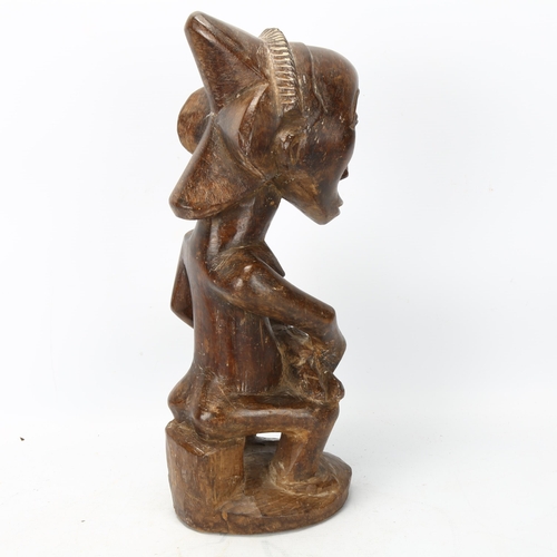 90 - A Luba, Congo, wood carved figure of mother and child in the style of the Buli Master, height 37cm