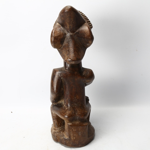 90 - A Luba, Congo, wood carved figure of mother and child in the style of the Buli Master, height 37cm