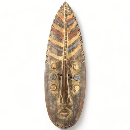 78H - A Grebo, Ivory Coast, wood carved face mask in the form of a leaf, height 52cm