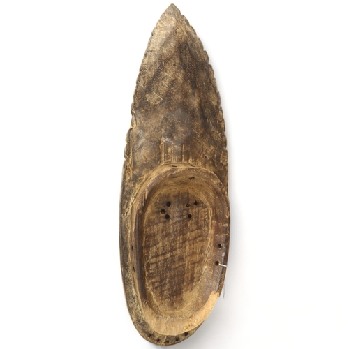 78H - A Grebo, Ivory Coast, wood carved face mask in the form of a leaf, height 52cm