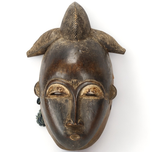 78A - A Baule, Ivory Coast, wood carved portrait mask, height 31cm