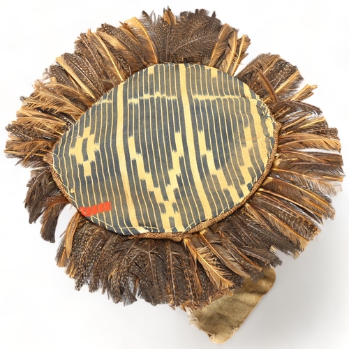 78E - A large Dan, Ivory Coast headdress, with feather and shell decoration, height approx 56cm