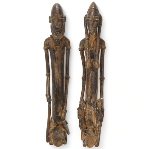 78G - Two Dogon, Ghana, copper figures, a male warrior and woman with children, height 32cm