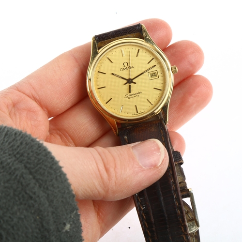 1020 - OMEGA - a gold plated stainless steel Seamaster quartz calendar wristwatch, ref. 1430, champagne dia... 