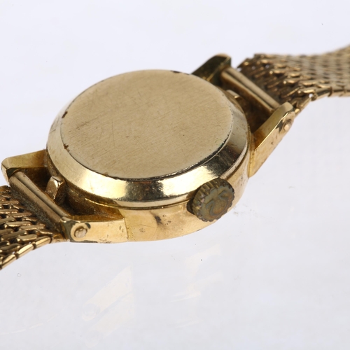 1038 - OMEGA - a lady's gold plated mechanical bracelet watch, ref. 511.166, circa 1965, silvered dial with... 