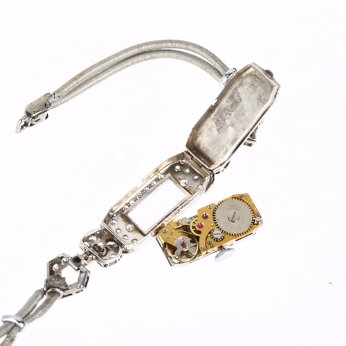 1040 - A lady's Art Deco platinum and diamond cocktail mechanical wristwatch, circa 1930s, silvered dial wi... 