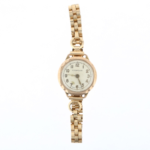 1043 - PRESTIGE - a lady's 9ct gold mechanical wristwatch, silvered dial with applied gilt Arabic numerals,... 