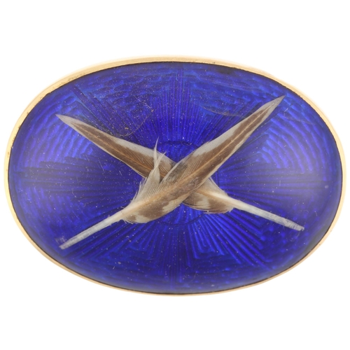 1104 - *DESCRIPTION CHANGE* An Antique feather bombe brooch, with crossed real feather motif beneath convex... 