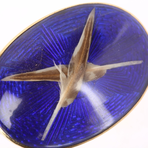 1104 - *DESCRIPTION CHANGE* An Antique feather bombe brooch, with crossed real feather motif beneath convex... 