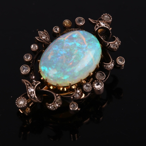 1106 - An Art Nouveau opal and diamond openwork pendant/brooch, circa 1905, centrally claw set with 4.25ct ... 