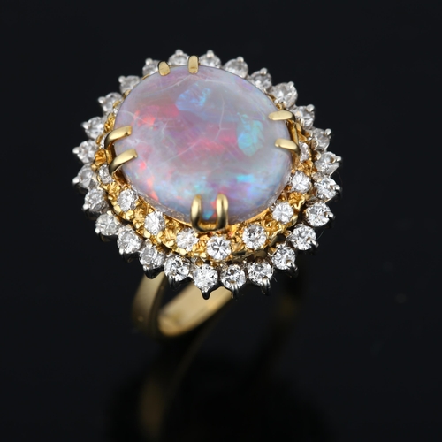 1107 - A late 20th century 18ct gold opal and diamond oval cluster ring, maker PS Ltd, import London 1976, ... 