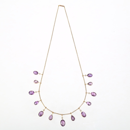 1108 - An Edwardian amethyst and split pearl fringe necklace, circa 1910, each offset drop claw set with ov... 