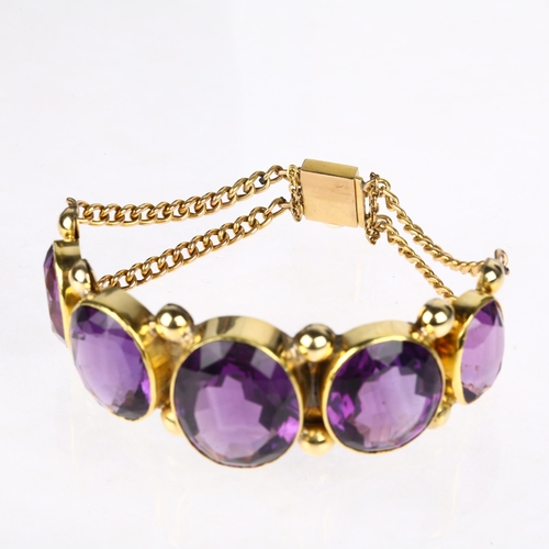 1109 - A large Victorian graduated five stone amethyst bracelet, circa 1860, rub-over set with oval mixed-c... 