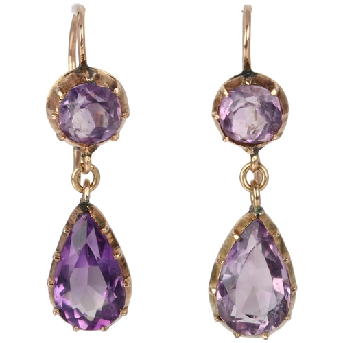 1110 - A pair of Edwardian amethyst drop earrings, cut-down collet set with pear and round-cut amethysts wi... 