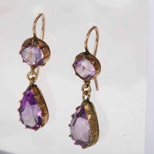 1110 - A pair of Edwardian amethyst drop earrings, cut-down collet set with pear and round-cut amethysts wi... 