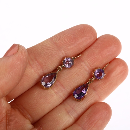 1110 - A pair of Edwardian amethyst drop earrings, cut-down collet set with pear and round-cut amethysts wi... 