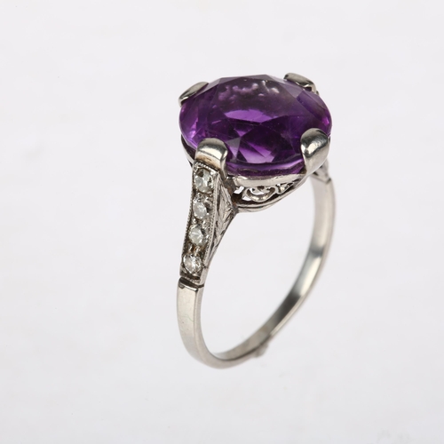 1111 - An Art Deco amethyst and diamond dress ring, claw set with oval mixed-cut amethyst and round-cut dia... 