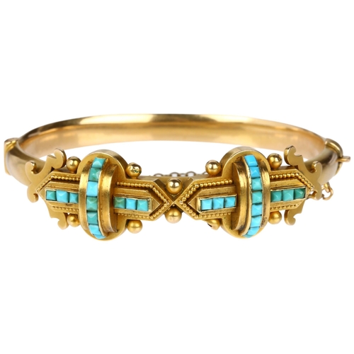 1116 - A Victorian 15ct gold Etruscan Revival turquoise hinged bangle, circa 1880, the central double cross... 